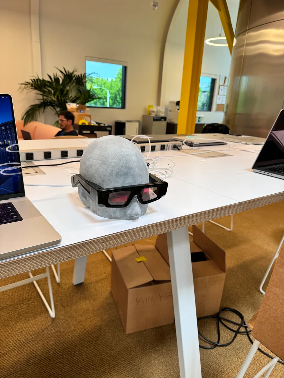 Spectacles resting on a worktable
